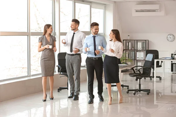 stock-photo-colleagues-drinking-coffee-office